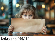 Curious little girl peeking over blank paper sign. Стоковое AI-изображение, AI-художник Иван Рябоконь / Фотобанк Лори