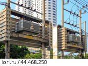 High voltage transformers with wires that convert electricity. Power engineering and construction. Стоковое фото, фотограф Коханова Наталья / Фотобанк Лори