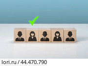 HR, Human resources and team completing. Human resources and CEO concept. recruiter complete team by one person. Employees are represented by wooden cubes with icons. Стоковое фото, фотограф Павел Муравьев / Фотобанк Лори