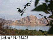 Mountain lake at the foot of the undulating mountain (2018 год). Стоковое фото, фотограф Evgenii Predibailo / Фотобанк Лори