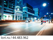 Modern houses and skyscrapers in Casablanca at night. Frantic rhythm of city. Traffic on the night highway. Стоковое фото, фотограф Евгений Ткачёв / Фотобанк Лори