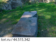 Koporye Fortress. Fragment of a tombstone (2024) Редакционное фото, фотограф Анна Кривицкая / Фотобанк Лори