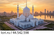 Hazrat sultan mosque bathing in golden light of sunrise in nur-sultan kazakhstan. Стоковое AI-изображение, AI-художник Юрий Поздников / Фотобанк Лори