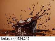 Highspeed image capturing a detailed chocolate splash with droplets suspended in midair. Стоковое AI-изображение, AI-художник Иван Рябоконь / Фотобанк Лори