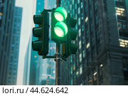 Urban green traffic lights on city street. Стоковое AI-изображение, AI-художник Иван Рябоконь / Фотобанк Лори