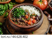 Traditional brazilian feijoada with rice. Стоковое AI-изображение, AI-художник Иван Рябоконь / Фотобанк Лори