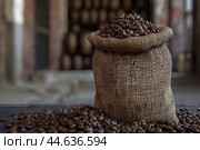 Burlap bag full of roasted coffee beans. Стоковое AI-изображение, AI-художник Иван Рябоконь / Фотобанк Лори