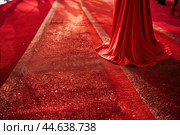 Elegance on red carpet closeup of gown and shimmering fabric. Стоковое AI-изображение, AI-художник Иван Рябоконь / Фотобанк Лори