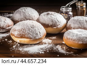 Irresistible Sufganiyot powdered sugar. Generate Ai. Стоковое AI-изображение, AI-художник Иван Рябоконь / Фотобанк Лори