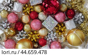 Christmas Ornaments Background Rotation, Spinning. Close up a Glitter Christmas Tree Decoration Items is Turning. Backdrop of New Year Ornate. Many Shiny Xmas Bauble, Balls and Bulbs. Top View, Frame. Стоковое видео, видеограф Марина Демидюк / Фотобанк Лори