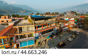 Pokhara, Nepal - November 11, 2018: View of the Phewa lake and Pokhara streets early in the morning. Редакционное фото, фотограф VittoriaChe / Фотобанк Лори