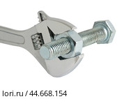 Разводной гаечный ключ на белом фоне. An adjustable wrench on a white background. Стоковое фото, фотограф Татьяна Д / Фотобанк Лори