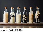 Assorted milk bottles on wooden stand. Стоковое AI-изображение, AI-художник Иван Рябоконь / Фотобанк Лори