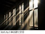 Serene rays through vintage windows. Стоковое AI-изображение, AI-художник Иван Рябоконь / Фотобанк Лори