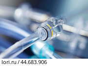 Close up of medical catheter tube connecting to other equipment. Стоковое AI-изображение, AI-художник Иван Рябоконь / Фотобанк Лори