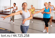 Group of active women practicing energetic dance in a studio. Стоковое фото, фотограф Яков Филимонов / Фотобанк Лори