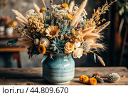 A beautiful bouquet of dried flowers in a ceramic vase on an antique wooden chest of drawers. A bouquet of flowers in a vase in a home interior. Light, beige, blue floral background. Стоковое AI-изображение, AI-художник Photojuli / Фотобанк Лори