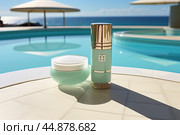 A cosmetic skin care kit on a marble rim against the background of a beautiful swimming pool against the background of a sea beach. Стоковое AI-изображение, AI-художник Ярославский Максим / Фотобанк Лори