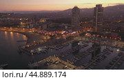 Scenic aerial panoramic view of modern Barcelona cityscape on Mediterranean coast with marina at summer twilight, Spain. Стоковое видео, видеограф Яков Филимонов / Фотобанк Лори
