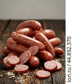 Sausages - November 13th every year - birthday! It was on this day in 1805 that Johann Laner created the first sausage and called it "Viennese". Enjoy your meal! Стоковое AI-изображение, AI-художник Сергей Елизарьев / Фотобанк Лори