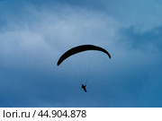 Paragliding. Man in the sky. Стоковое фото, фотограф YuryKara / Фотобанк Лори