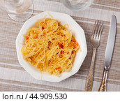 Homemade pickled cabbage on white plate closeup, natural probiotic. Стоковое фото, фотограф Яков Филимонов / Фотобанк Лори