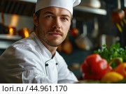 An attractive male chef, showcasing his culinary mastery and charisma. Редакционное AI-изображение, AI-художник Veniamin Kraskov / Фотобанк Лори