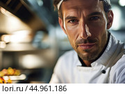 An attractive male chef, showcasing his culinary mastery and charisma. Редакционное AI-изображение, AI-художник Veniamin Kraskov / Фотобанк Лори