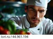 An attractive male chef, showcasing his culinary mastery and charisma. Редакционное AI-изображение, AI-художник Veniamin Kraskov / Фотобанк Лори