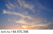 Cirrus Ci is genus of high cloud made of ice crystals, appear delicate wispy white strands. Cirrus formed when warm dry air rises, water vapor deposition onto dust particles at high altitudes. Стоковое видео, видеограф Юлия Петровская / Фотобанк Лори