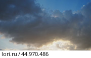 Beautiful clouds in sky. Volumetric light cumulus effect. The sunrays are hidden behind dark clouds. Convection in troposphere. Movement of moisture in atmosphere. Weather forecast. Стоковое видео, видеограф Юлия Петровская / Фотобанк Лори