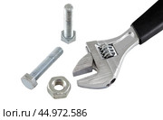 Разводной гаечный ключ на белом фоне. An adjustable wrench on a white background. Стоковое фото, фотограф Татьяна Д / Фотобанк Лори