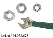 Разводной гаечный ключ на белом фоне. An adjustable wrench on a white background. Стоковое фото, фотограф Татьяна Д / Фотобанк Лори