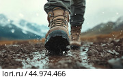 Hiker navigating a muddy trail during a rainy day in a forested area. Стоковое AI-изображение, AI-художник Юлия Гапеенко / Фотобанк Лори