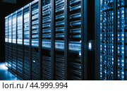 AI Working Data Center With Rows of Rack Servers. Emergency Led Lights Blinking and Computers are Working. Dark Ambient Light. Generative AI. Стоковое AI-изображение, AI-художник Павел Муравьев / Фотобанк Лори