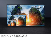 Comparing TV resolutions on television screen. TV ultra HD resolution. 8K resolutions compare on oled tv. Watching television in TV room. Compare of television resolution. Стоковое фото, фотограф Павел Муравьев / Фотобанк Лори