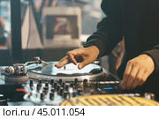 Photography of the modern premium stage mixed board / desk with vinyl turntable and vinyl plate. Close frontal view. Стоковое фото, фотограф YuryKara / Фотобанк Лори