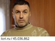 Portrait of a thoughtful and surprised middle-aged man in a wool sweater close-up. Стоковое фото, фотограф Андрей С / Фотобанк Лори