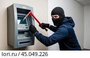 Masked thief attempting ATM robbery with crowbar. Стоковое AI-изображение, AI-художник Андрей Бакусов / Фотобанк Лори