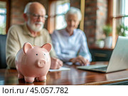 Pension. Saving money. Savings. Piggy bank in the form of a pig in close-up, Calculating the total amount of the budget. An elderly man learns how to interact with a laptop in online payments, finance, loans, transactions. Стоковое AI-изображение, AI-художник Photojuli / Фотобанк Лори