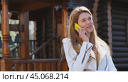 Calling by Phone. Happy young woman talking on cell phone. Стоковое видео, видеограф Андрей Аркуша / Фотобанк Лори
