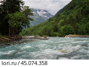 View of the Psysh River and the Amanauz-Bashi Mountain of the Northern Caucasus Mountains near the village of Arkhyz on a sunny summer day, Karachay-Cherkessia, Russia. Стоковое фото, фотограф Ula Ulachka / Фотобанк Лори