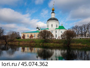 View of the Vyazma Museum of Local History located in the Bogoroditskaya Church on the banks of the Vyazma River on a sunny autumn day with clouds, Vyazma, Smolensk region, Russia. Стоковое фото, фотограф Ula Ulachka / Фотобанк Лори