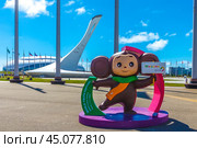 Sochi, Russia - June 10, 2024: Sochi Olympic Park. Federal Territory Sirius. Cheburashka invites to World Youth Festival 2024. Singing fountain. Чебурашка и поющий фонтан в Олимпийском парке на Федеральной территории Сириус, Сочи, Россия. Редакционное фото, фотограф Елена Серебрякова / Фотобанк Лори