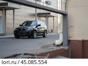 KRASNOYARSK, RUSSIA - June 15, 2024: Black BMW X5 E70. Редакционное фото, фотограф Плотников Дмитрий / Фотобанк Лори