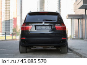 KRASNOYARSK, RUSSIA - June 15, 2024: Black BMW X5 E70. Редакционное фото, фотограф Плотников Дмитрий / Фотобанк Лори