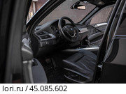 KRASNOYARSK, RUSSIA - June 15, 2024: Black BMW X5 E70. Редакционное фото, фотограф Плотников Дмитрий / Фотобанк Лори