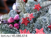The branch of blue spruce with toys close-up.  Christmas tree background. Стоковое фото, фотограф Лариса Гордеева / Фотобанк Лори