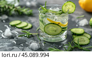 Refreshing Glass of Water With Cucumbers and Lemons. Стоковое AI-изображение, AI-художник Юлия Гапеенко / Фотобанк Лори