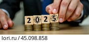 Revenue Rise in Year 2025 with Ascending Coin Stacks and Bullseye Aim on Block, Conceptual Image of Economic Prosperity, Strategic Financial Planning for Future Profitability. Стоковое AI-изображение, AI-художник Павел Муравьев / Фотобанк Лори